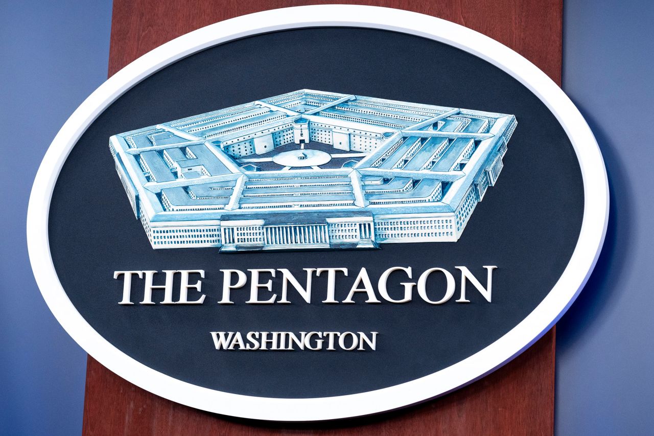 The Department of Defense logo is seen on the wall of the Pentagon press briefing room, in October.