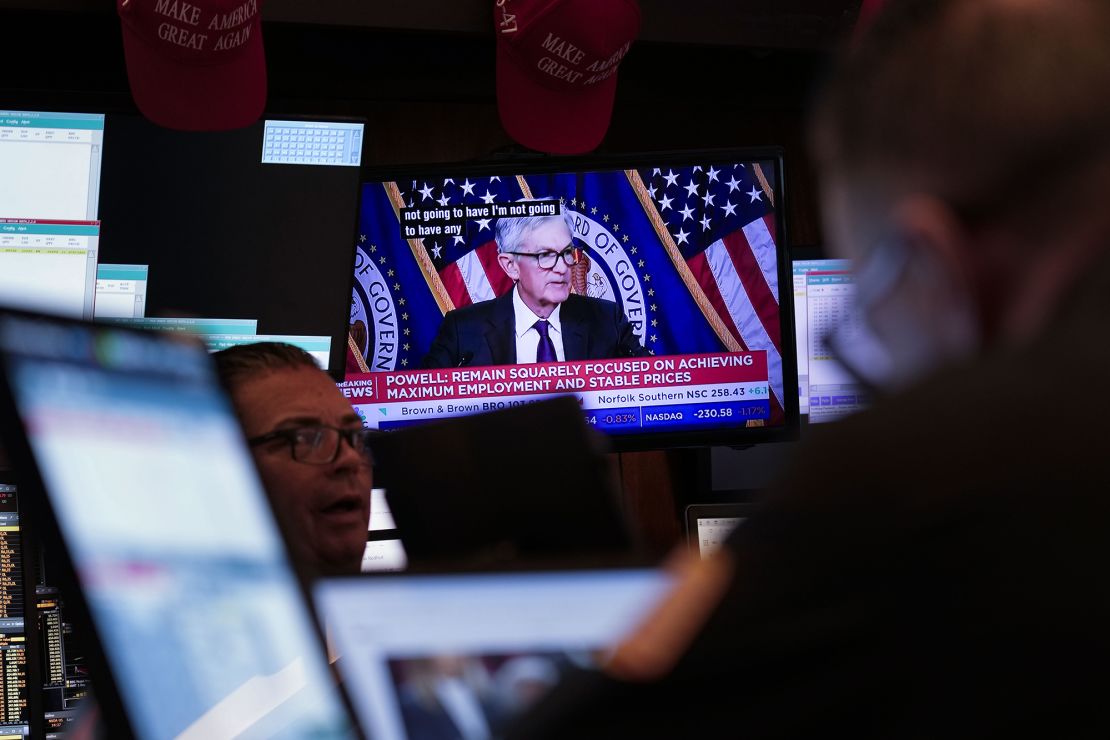 Screens display a news conference by Federal Reserve Chair Jerome Powell on the floor of the New York Stock Exchange on January 29.