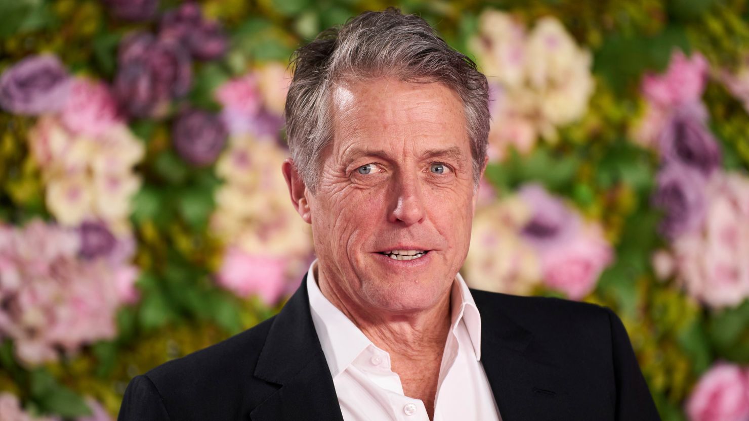 Hugh Grant poses for photographers upon arrival at the World premiere of the film 'Bridget Jones: Mad About the Boy' in London, on January 29.
