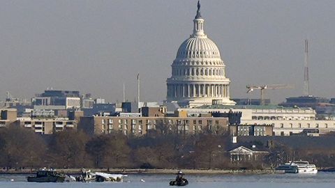 Search and rescue efforts are seen around a wreckage site in the Potomac River from Ronald Reagan Washington National Airport, early Thursday in Arlington, Va.