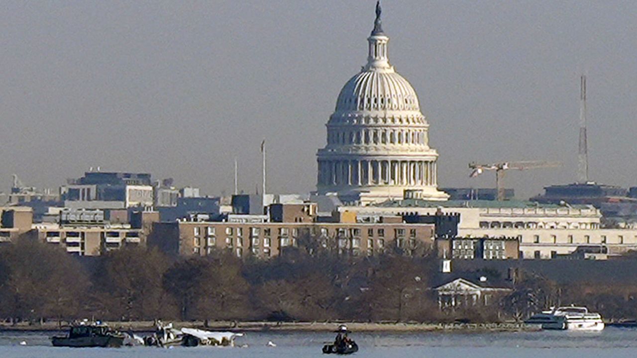 Search and rescue efforts are seen around a wreckage site in the Potomac River from Ronald Reagan Washington National Airport, early Thursday in Arlington, Va.