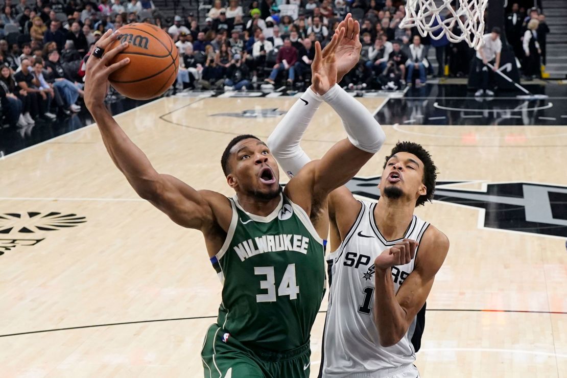 Milwaukee Bucks forward Giannis Antetokounmpo drives to the basket against San Antonio Spurs center Victor Wembanyama.