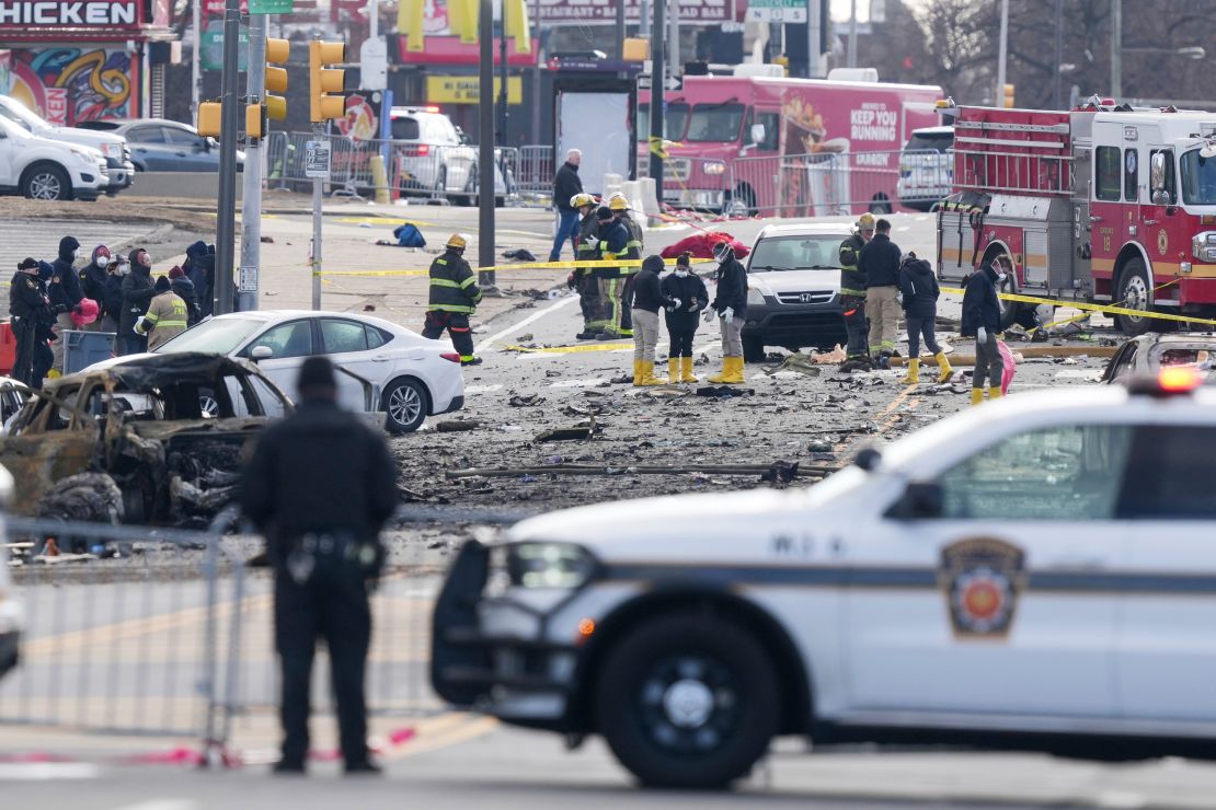 Investigators work on Saturday after a small aircraft crashed in Philadelphia on Friday night.