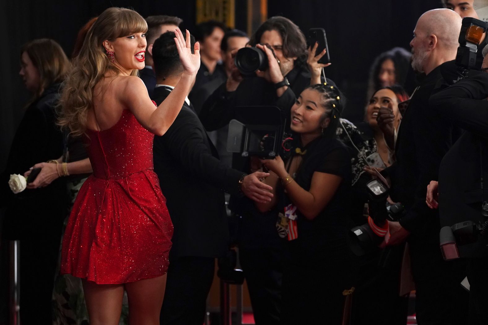 Taylor Swift walks the red carpet. The megastar <a href="https://www.cnn.com/entertainment/live-news/the-grammys-award-show-02-2-25#cm6o97jaq001f3b6m5fug76rm">showed up in a short, sparkly red dress</a>.