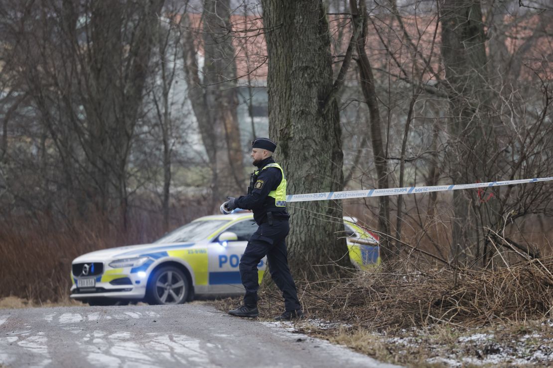 Authorities cordon off the site of the shooting at school. Swedish police warned "the danger is not over."