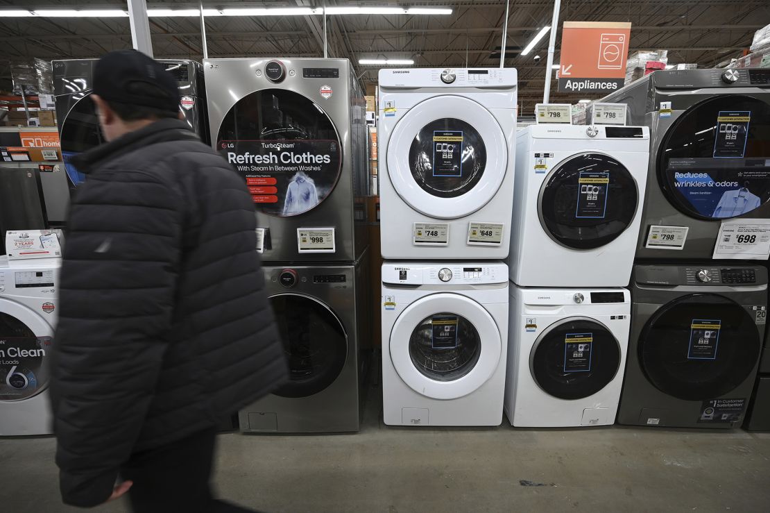 A man walks past washing machines at a Home Depot. Such appliances could cost more after President Donald Trump imposed 25% steel and aluminum tariffs.