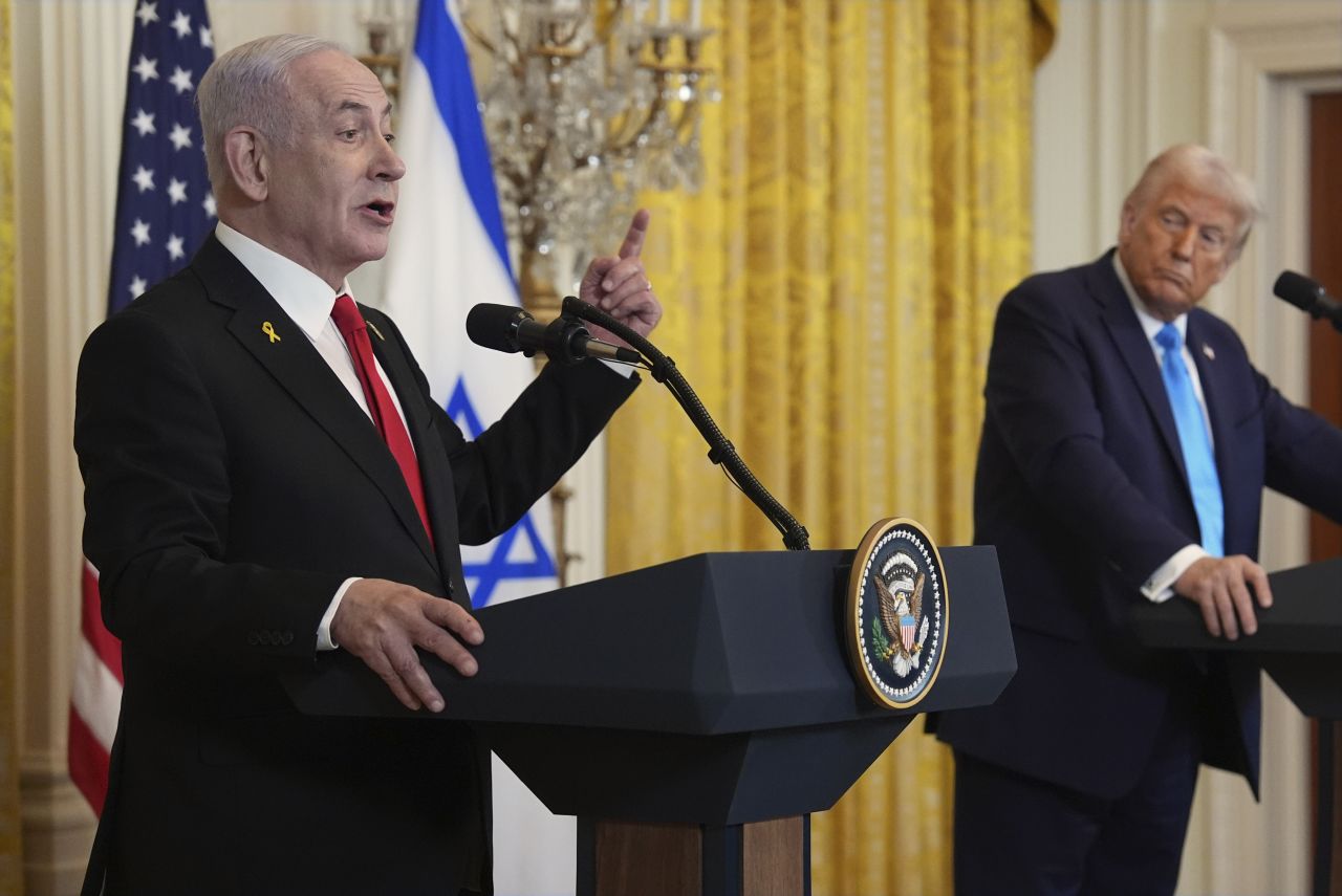 President Donald Trump listens as Israeli Prime Minister Benjamin Netanyahu speaks during a news conference at the White House on Tuesday.