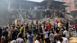 People stand around the vandalized residence of Sheikh Mujibur Rahman, Bangladesh's former leader and the father of the country's ousted Prime Minister Sheikh Hasina, in Dhaka, on February 6, 2025.