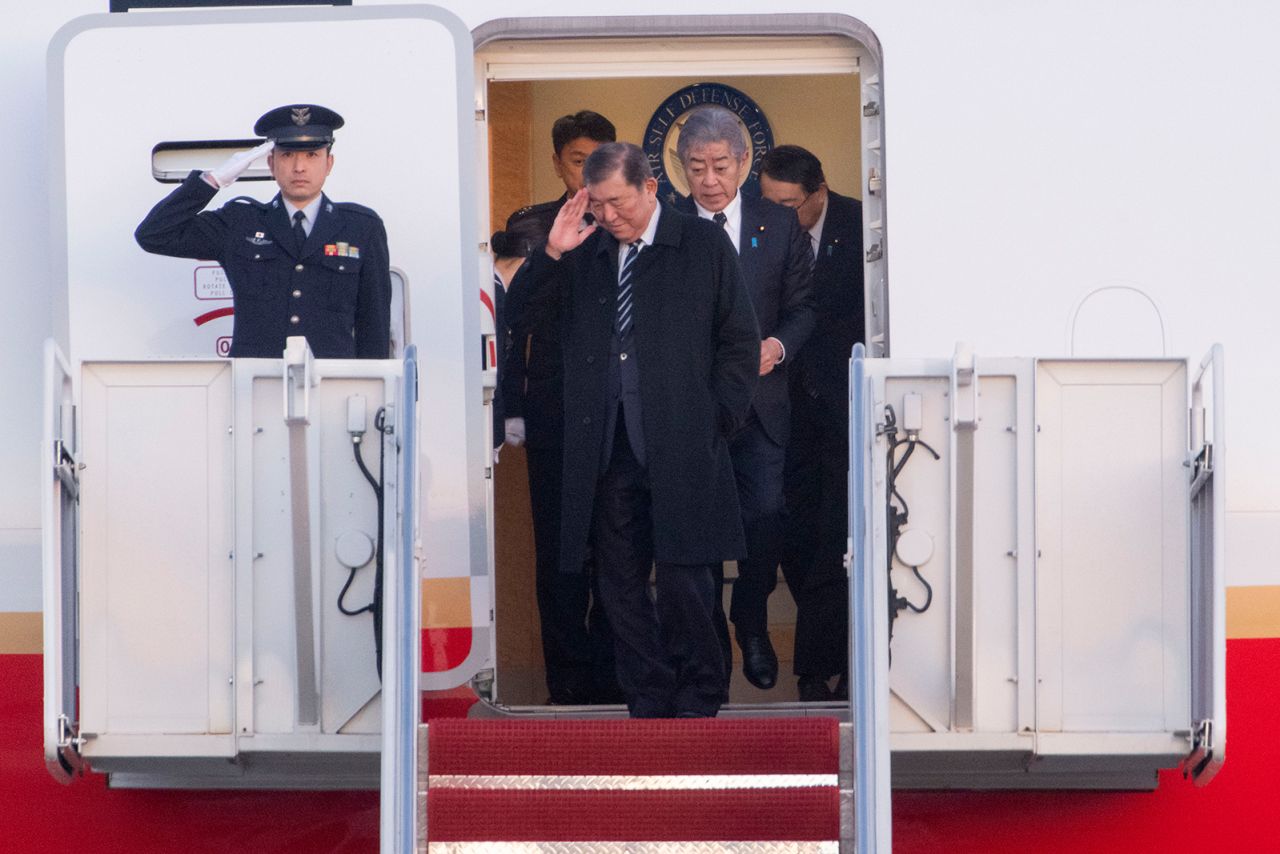 Japan's Prime Minister Shigeru Ishiba salutes as he arrives at Joint Base Andrews, Maryland, on Thursday.