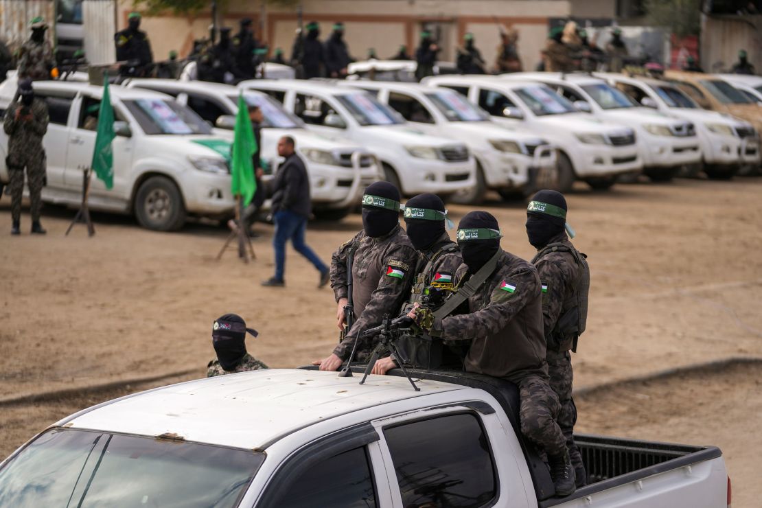 Hamas fighters deploy ahead of the hand over to the Red Cross of three Israeli hostages in Deir Al-Balah.