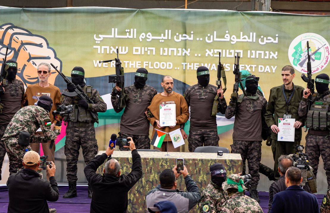 Ohad Ben Ami, Eli Sharabi and Or Levy are escorted by Hamas militants in Gaza on Saturday.