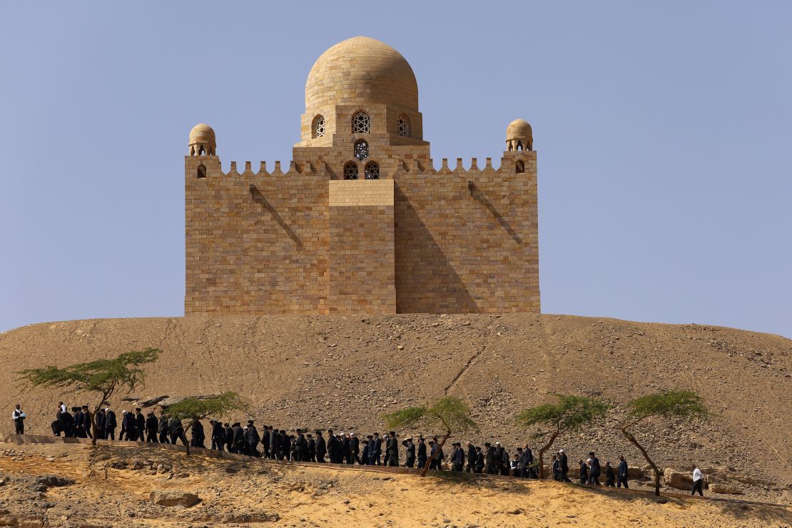 Relatives of Prince Karim Al-Hussaini, the Aga Khan IV and 49th hereditary imam of the Shiite Ismaili Muslims, who died Tuesday in Portugal, walk during a funeral ceremony at the Aga Khan mausoleum, in Aswan, Egypt, on Feb. 9, 2025.