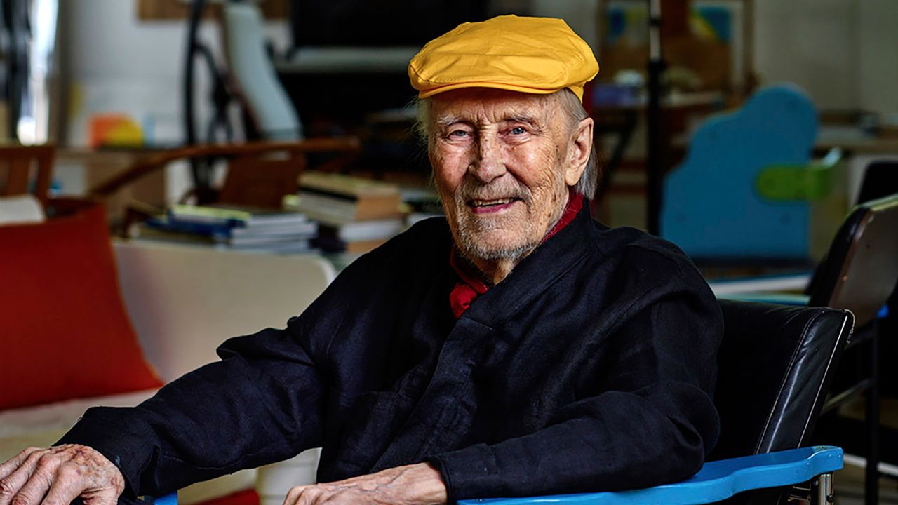 This undated image provided by Studio Kukkapuro shows Yrjö Kukkapuro, a renowned Finnish furniture designer whose postmodern style of chairs graced waiting rooms and museums alike, sitting in his famous Experimental chair in his studio outside Helsinki.