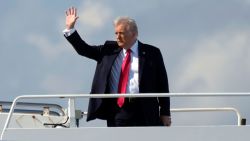 President Donald Trump, left, waves as he boards Air Force One at Palm Beach International Airport in West Palm Beach, Fla., Sunday, Feb. 9, 2025. (AP Photo/Ben Curtis)