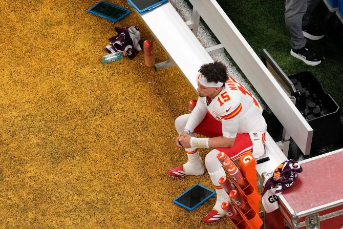 Mahomes sits on the bench during the first half. Mahomes and the Chiefs offense managed only 23 total yards in the first half. Mahomes threw two interceptions and was sacked three times.