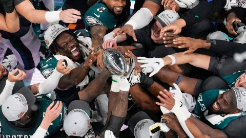 Philadelphia Eagles players celebrate with the Vince Lombardi Trophy after the Eagles won the NFL Super Bowl 59 football game against the Kansas City Chiefs, Sunday, Feb. 9, 2025, in New Orleans. (AP Photo/David J. Phillip)