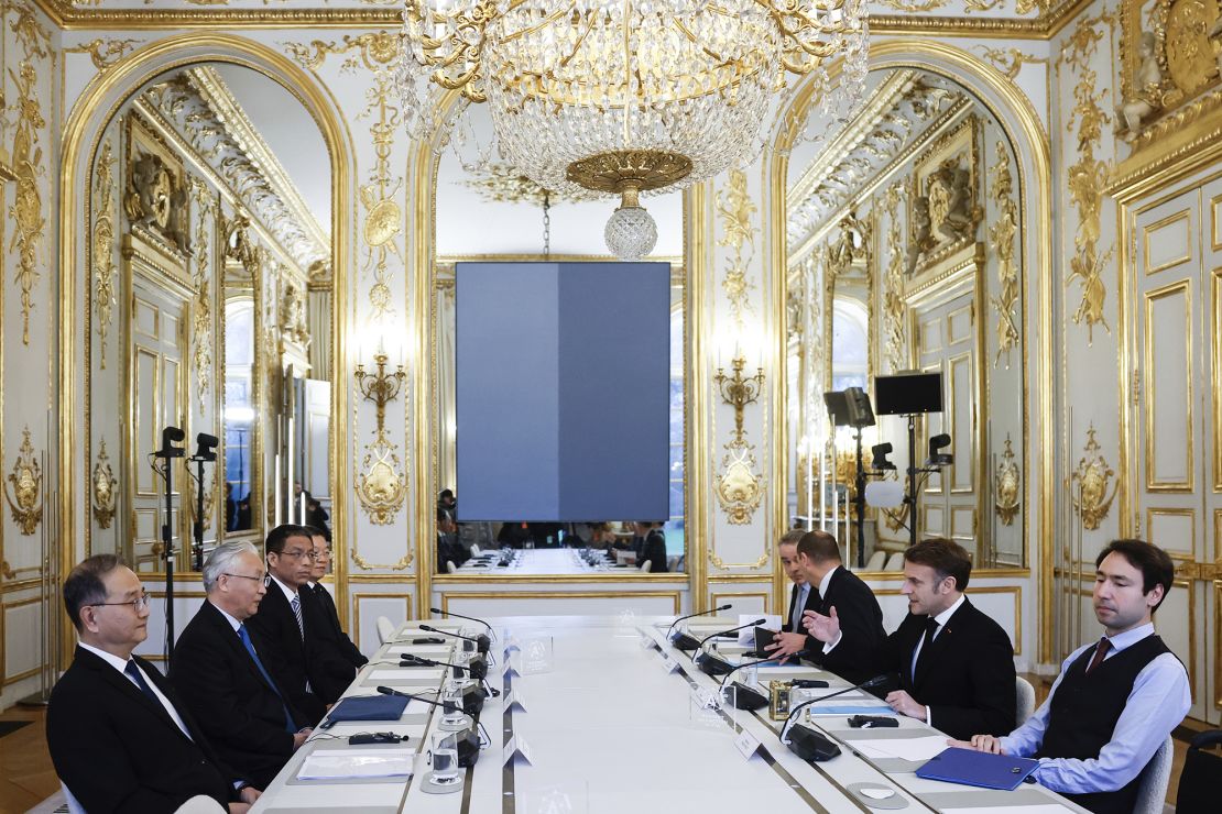 French President Emmanuel Macron (second right) meets with China's Vice Premier Zhang Guoqing (second left) at the Elysee Palace during events Monday on the sidelines of the AI Action Summit, Paris.