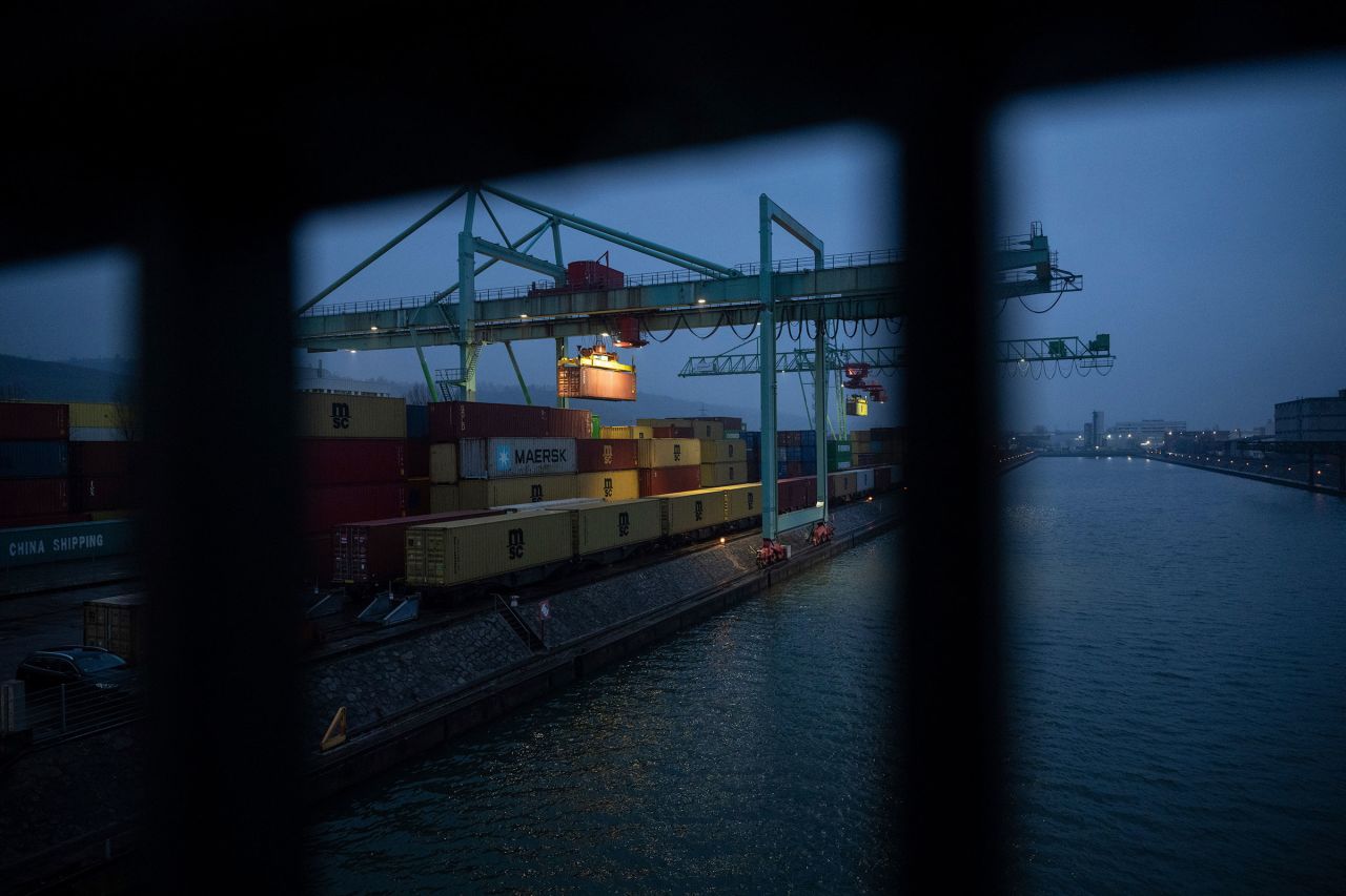 Shipping containers are reloaded at the port of Stuttgart, Germany, on Tuesday.