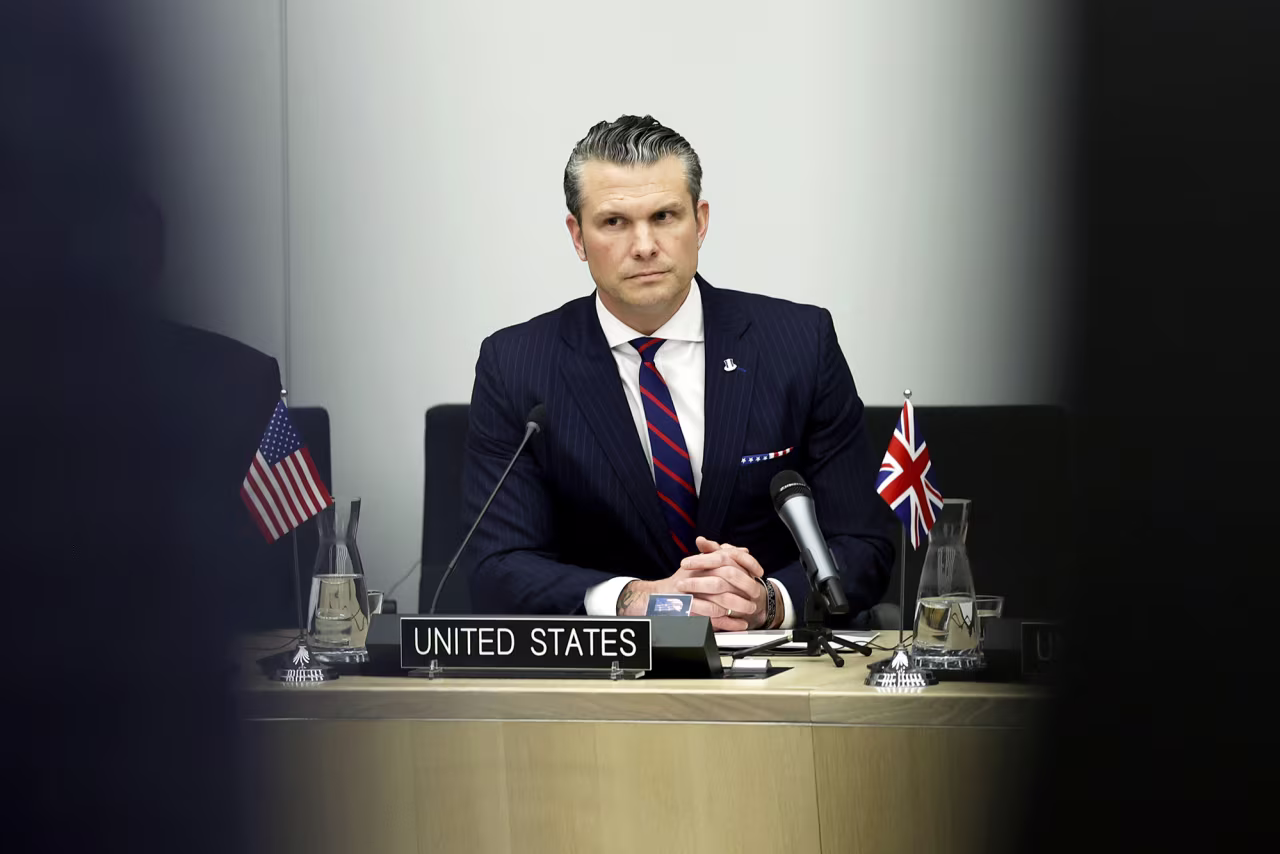 Secretary of Defense Pete Hegseth listens to opening statements during a meeting at NATO headquarters in Brussels on Wednesday.
