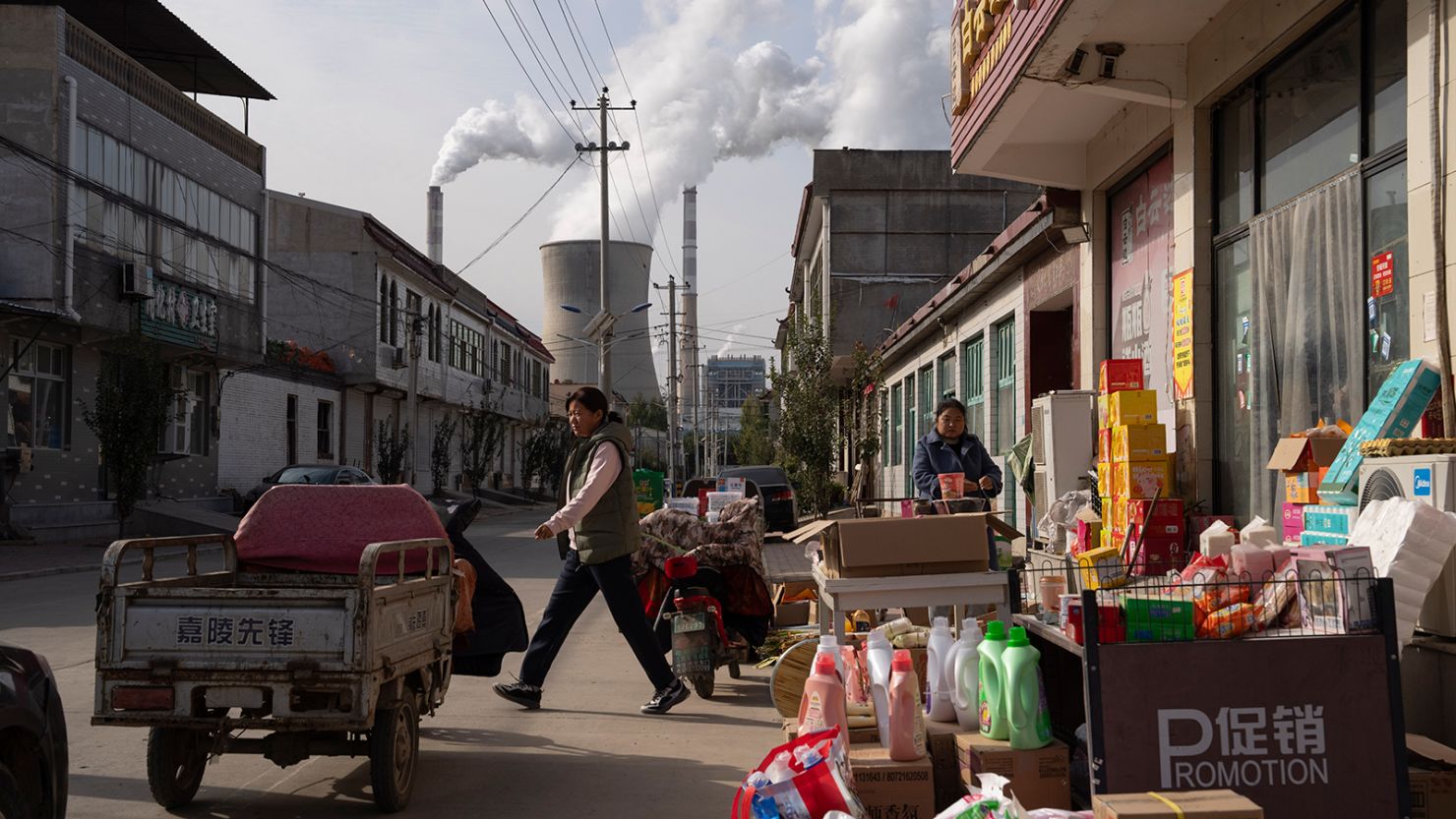 A coal-fired power plant seen from a street in Dingzhou, Baoding, in the northern China's Hebei province on November 10, 2023