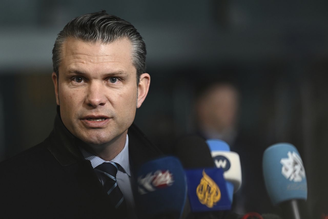 US Secretary of Defense Pete Hegseth speaks with the media as he arrives for a meeting of NATO defense ministers at NATO headquarters in Brussels, on Thursday.