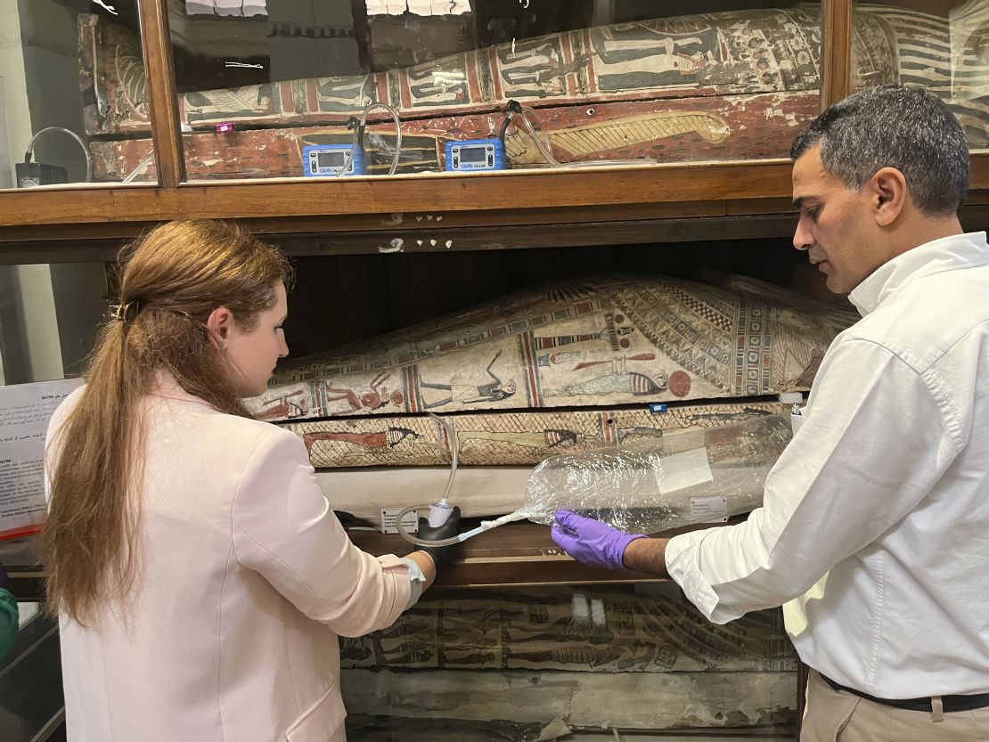 In this undated photo provided by Abdelrazek Elnaggar, Emma Paolin, PhD student at University of Ljubljana, sets up active air sampling with sorbent tubes and pumps.