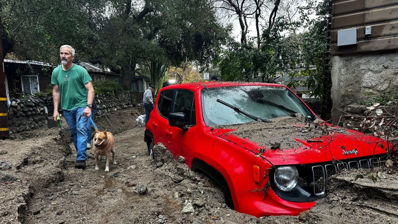 Torrents of mud and floodwater cover roads and trap cars in LA, but city dodges another disaster