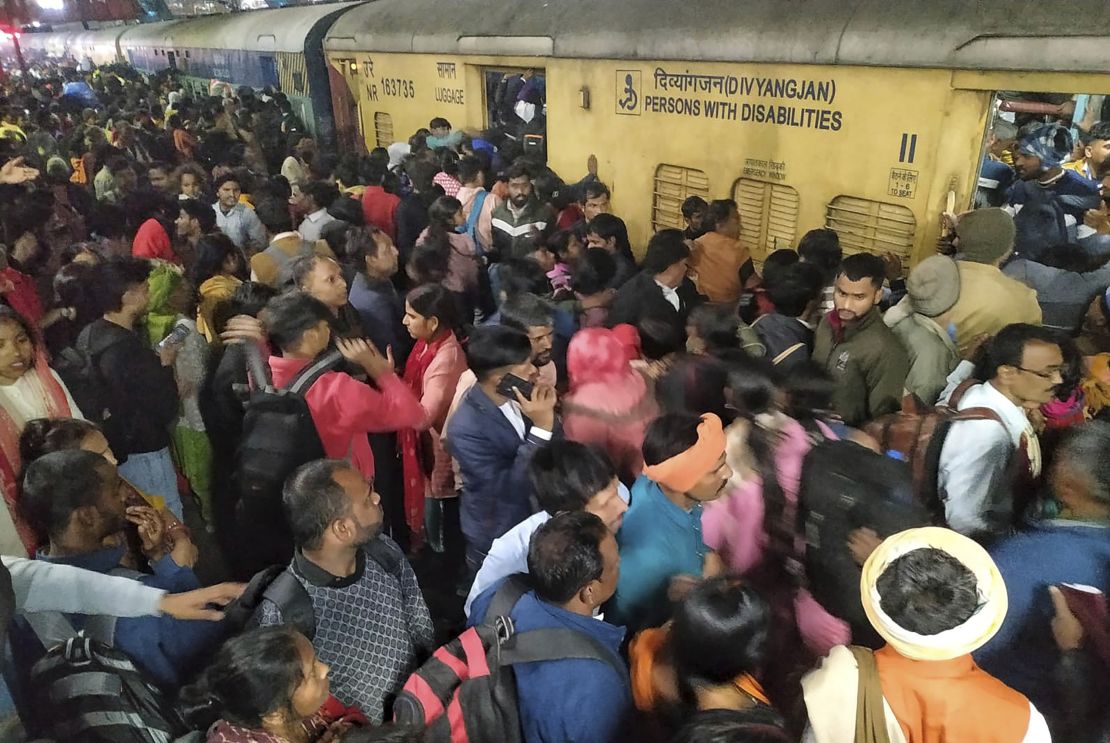 Passengers will take the train on February 15th, 2025 at a train station in New Delhi, India.