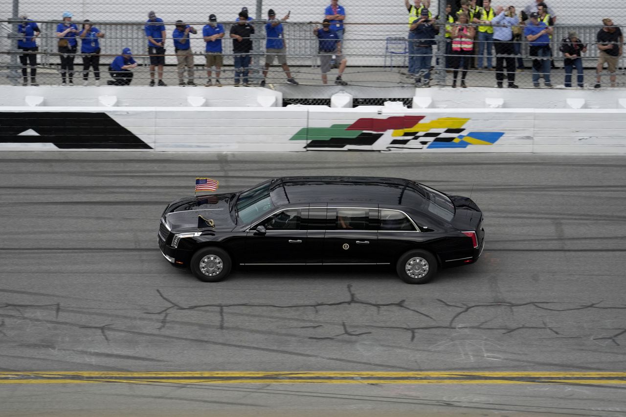 President Donald Trump rides in the presidential limousine, known as "The Beast," as he takes a pace lap ahead of the start of NASCAR's Daytona 500 race in Daytona Beach, Florida, on Sunday.