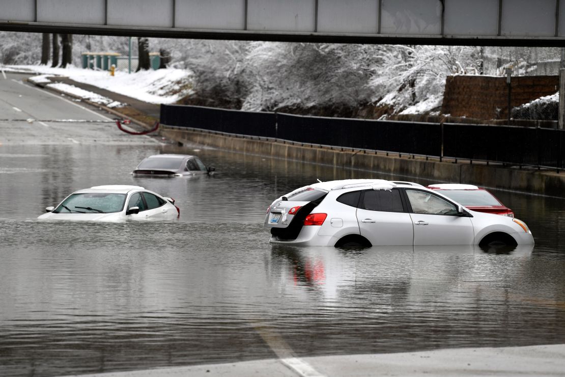 Cars sit in floodwater at a railroad underpass in Louisville, Kentucky, Sunday.