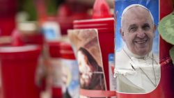 A candle with a portrait of Pope Francis is seen in front of the Agostino Gemelli Polyclinic, in Rome, Tuesday, Feb. 18, 2025, where Pope Francis has been hospitalised to undergo some necessary diagnostic tests and to continue his ongoing treatment for bronchitis. (AP Photo/Andrew Medichini)