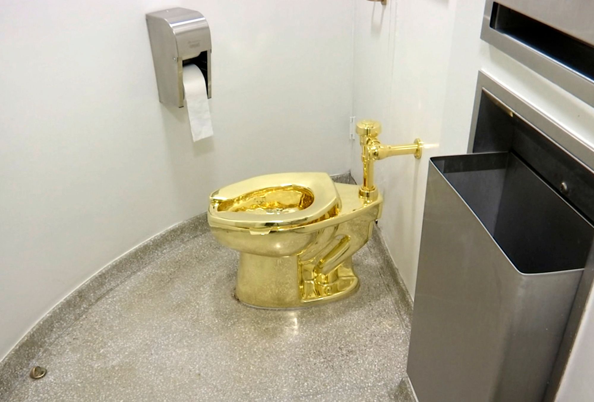 This screenshot made from a video shows the 18-carat toilet, by artist Maurizio Cattelan, in the restroom of the Solomon R. Guggenheim Museum in New York in 2016.