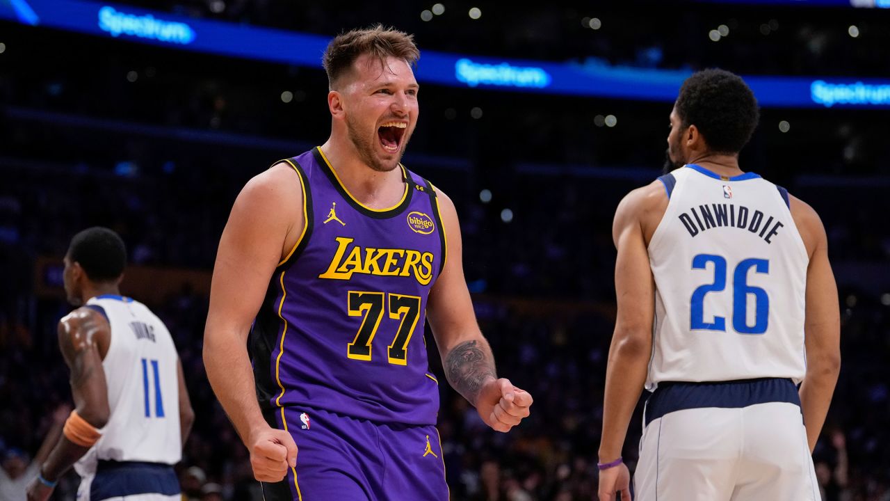 Los Angeles Lakers guard Luka Dončić reacts after scoring and drawing a foul against his former team Tuesday night.