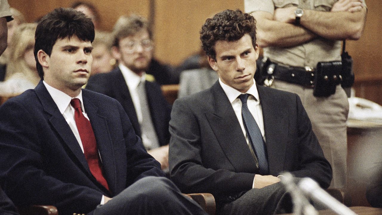 FILE - Lyle, left, and Erik Menendez sit in Beverly Hills Municipal Court where their attorneys delayed making pleas on behalf of the brothers who are suspected in the murders of their parents on March 12, 1990.  (AP Photo/Nick Ut)