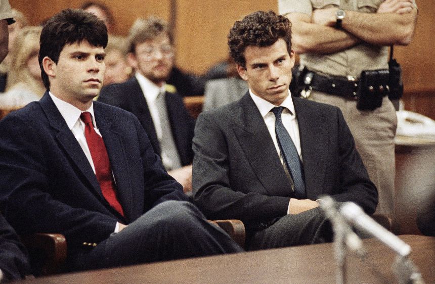 Lyle, left, and Erik Menendez sit in Beverly Hills Municipal Court where their attorneys delayed making pleas on behalf of the brothers who are suspected in the murders of their parents on March 12, 1990.