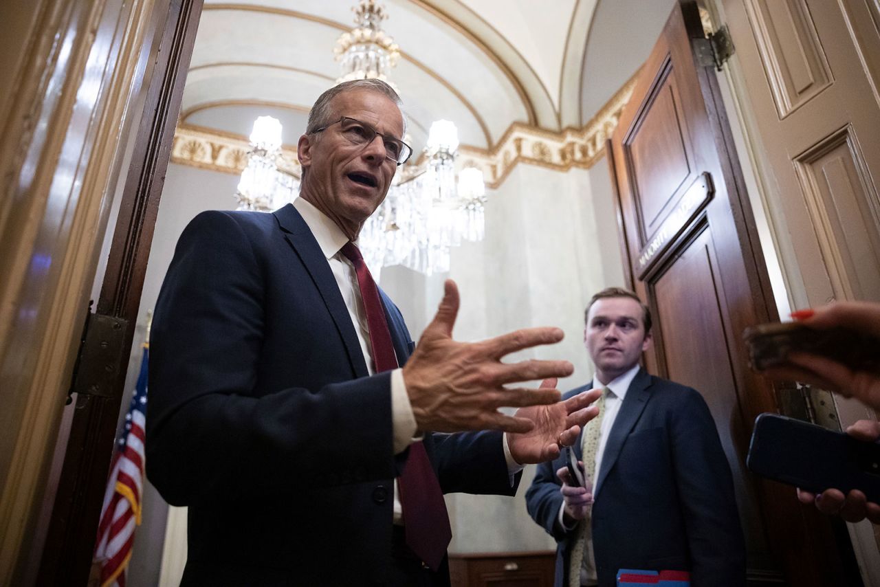 Senate Majority Leader John Thune stops to speak with reporters outside his office at the Capitol on Wednesday.