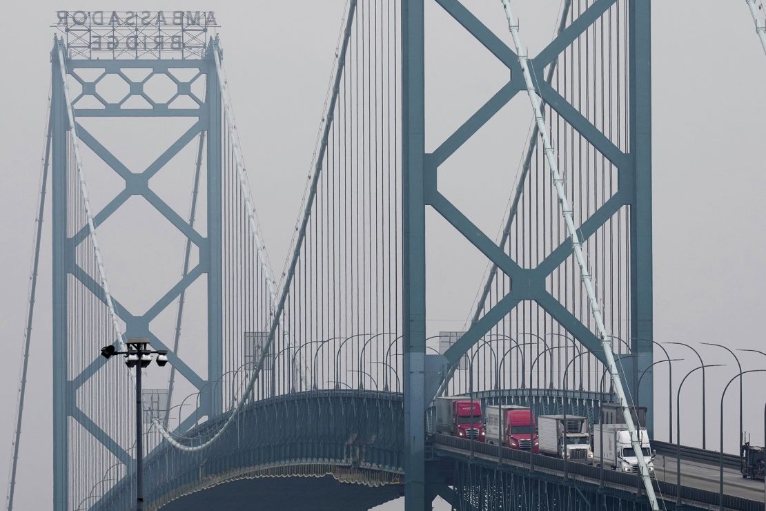 Trucks enter into the United States from Ontario, Canada across the Ambassador Bridge in Detroit on February 3.