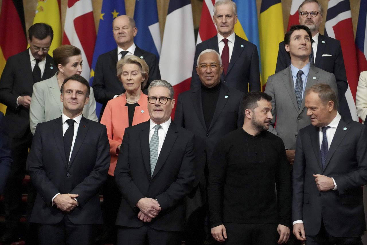 Front row left to right, French President Emmanuel Macron, Britain's Prime Minister Keir Starmer, Ukraine's President Volodymyr Zelenskyy and Poland's Prime Minister Donald Tusk stand with other leaders during a group photo at a summit on Ukraine at Lancaster House in London, on March 2, 2025.
