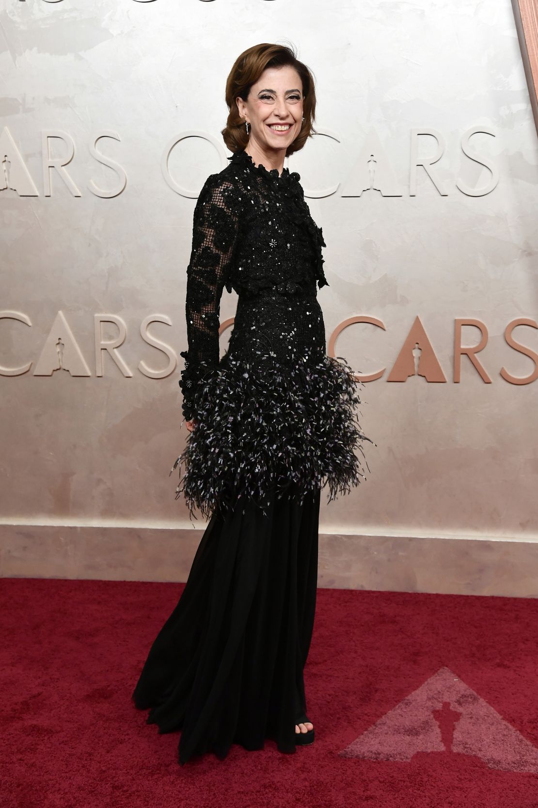 Best Actress nominee Fernanda Torres turned heads in an all-black number from Chanel’s Spring 2025 Couture, featuring a feathery skirt.