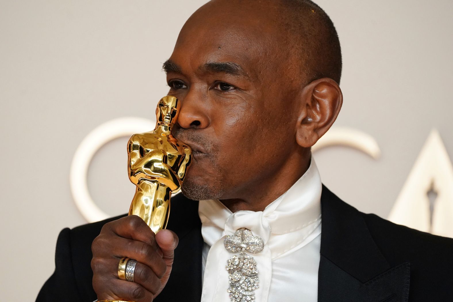 Paul Tazewell kisses his Oscar in the press room after "Wicked" won for best costume design. Tazewell noted in his acceptance speech that he is <a href="https://www.cnn.com/entertainment/live-news/oscars-academy-awards-03-02-25#cm7scgw4900003b6nuca5jzx0">the first Black man to win the award</a>. “This is absolutely astounding,” Tazewell said. “Thank you Academy for this very significant honor."