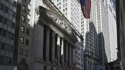 People walk past the New York Stock Exchange (NYSE) on March 3, 2025 in New York City.