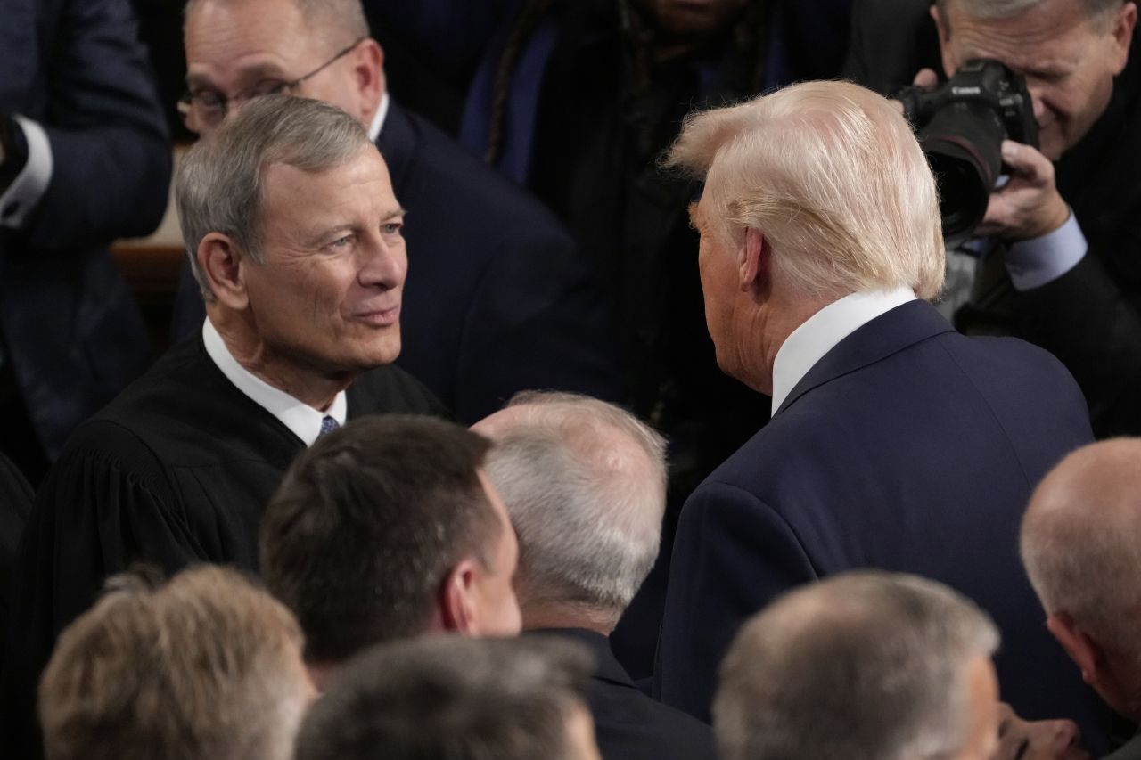 President Donald Trump greets Chief Justice of the United States John Roberts before he addresses a joint session of Congress in the House chamber of the US Capitol in Washington, DC, on March 4.