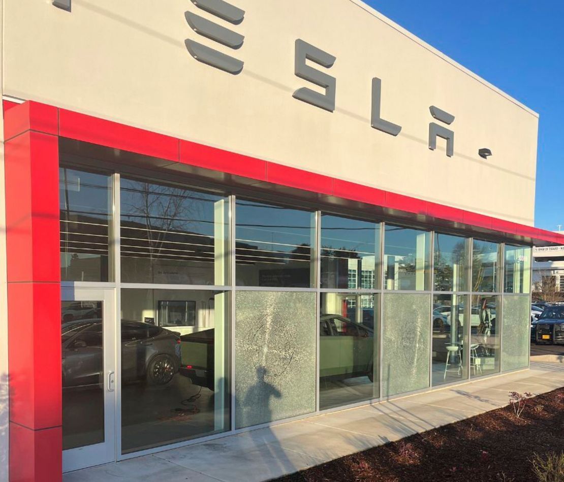 Shattered windows of a Tesla showroom that was shot up by an unknown vandal on March 6.