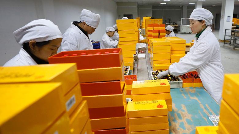 Employees work at a pharmaceutical production facility in Ji'an, Jiangxi Province of China, on March 6, 2025.