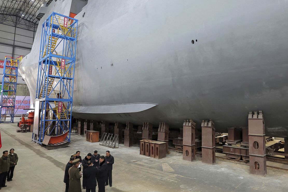 North Korean leader Kim Jong Un, bottom right, visits a shipyard that builds warships at an undisclosed location, in a photo provided by the North Korean government on March 8, 2025.