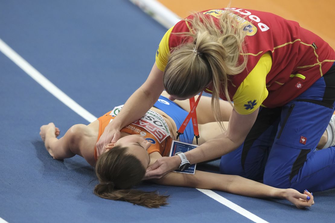 Koster receives medical treatment during the 3,000m final at the European Indoor Championships.