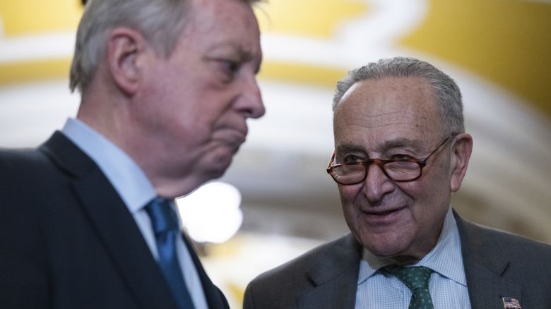 Senate Minority Leader Chuck Schumer speaks to Sen. Dick Durbin in Washington, March 11, 2025.