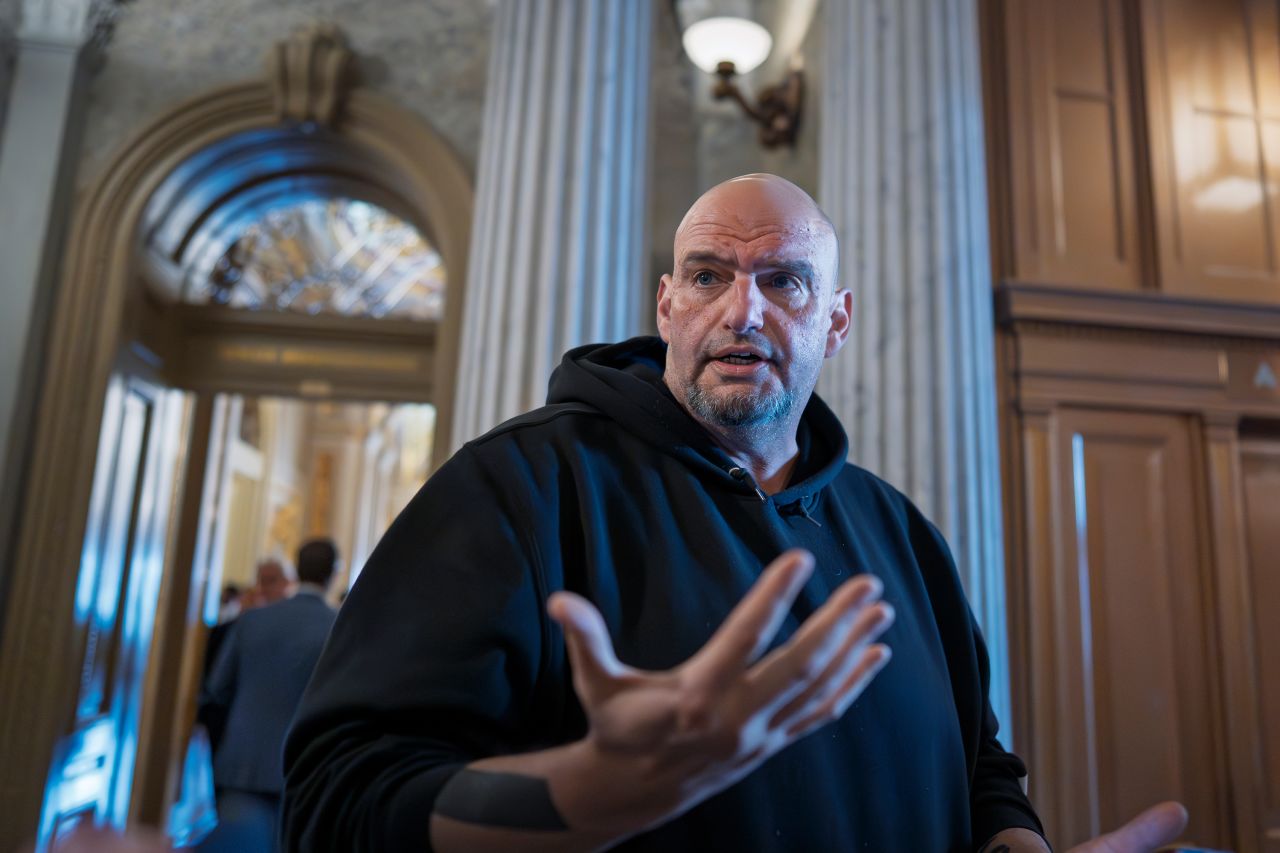 Sen. John Fetterman talks to reporters at the Capitol in Washington, DC on Thursday.
