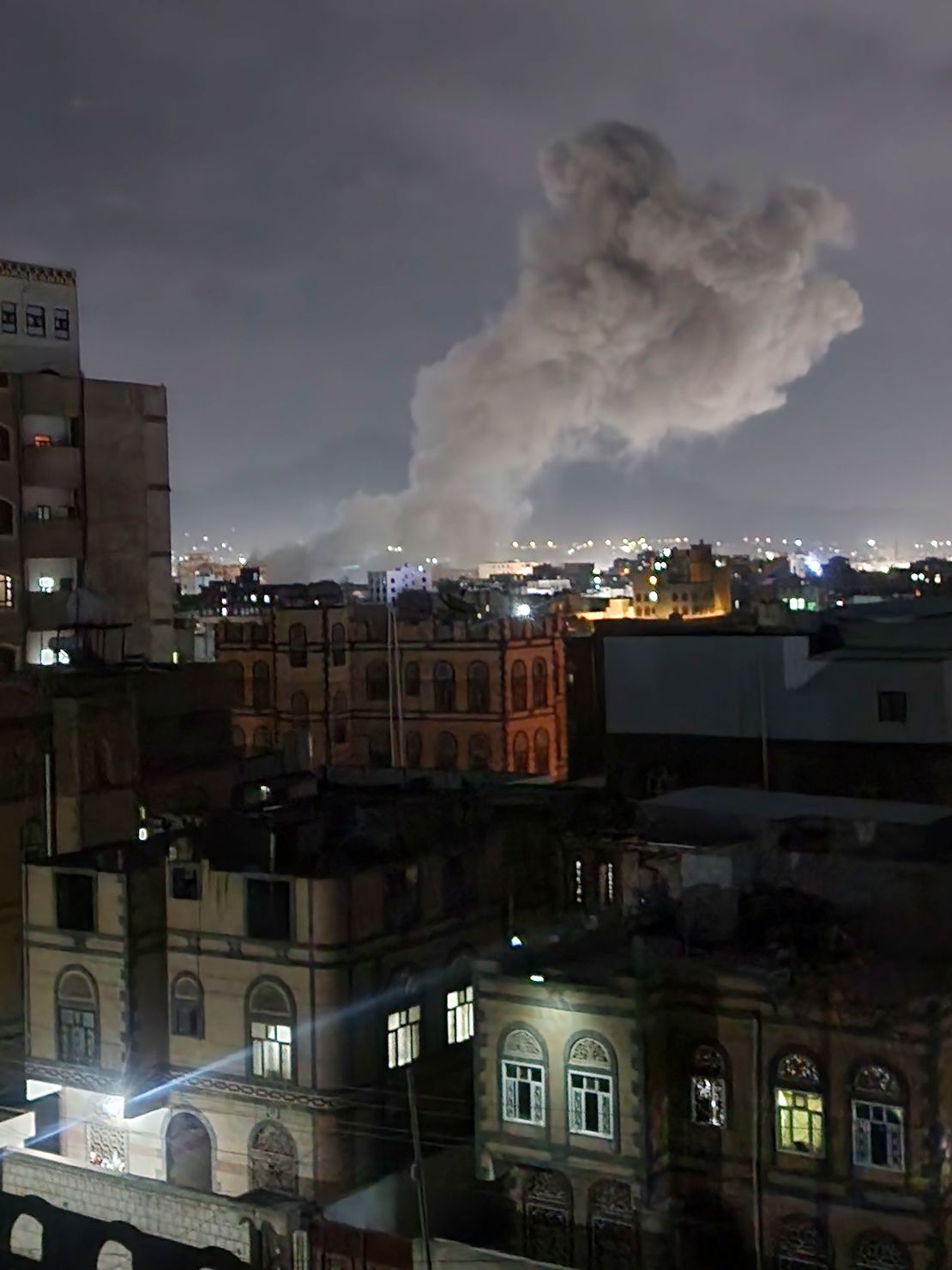 Smoke rises from a location reportedly struck by airstrikes in Sanaa, Yemen, on Saturday, the same day Trump announced airstrikes.