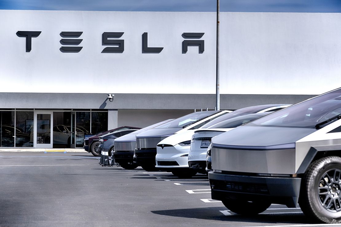 Tesla cars and trucks line a parking lots at a showroom and service center for Tesla in Los Angeles. Sales of Tesla have suffered the biggest drop in the company